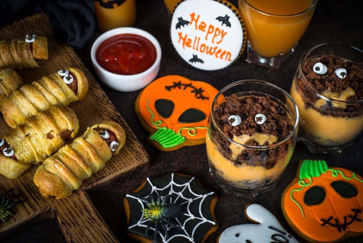 Halloween party food ideas, colorful and tasty with mummy hotdogs, pumpkin cookies, spiderwebbed cookies, happy halloween cookies and cookie crumb dessert sundaes 
My Family Ties 