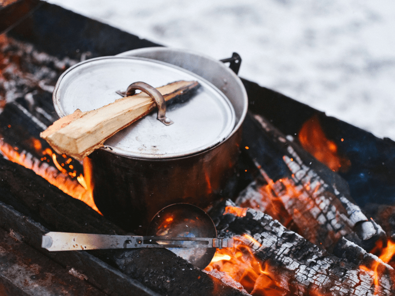 Cooking over an open fire an authentic smokey taste. Fireplace cooking guide with tips for beginners to create the perfect fireplace or firepit to cook on.