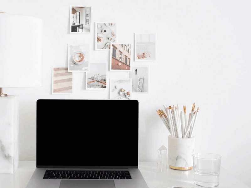 Desktop, laptop, marble, pencils, postcard on wall, online tools for blog, social squares,