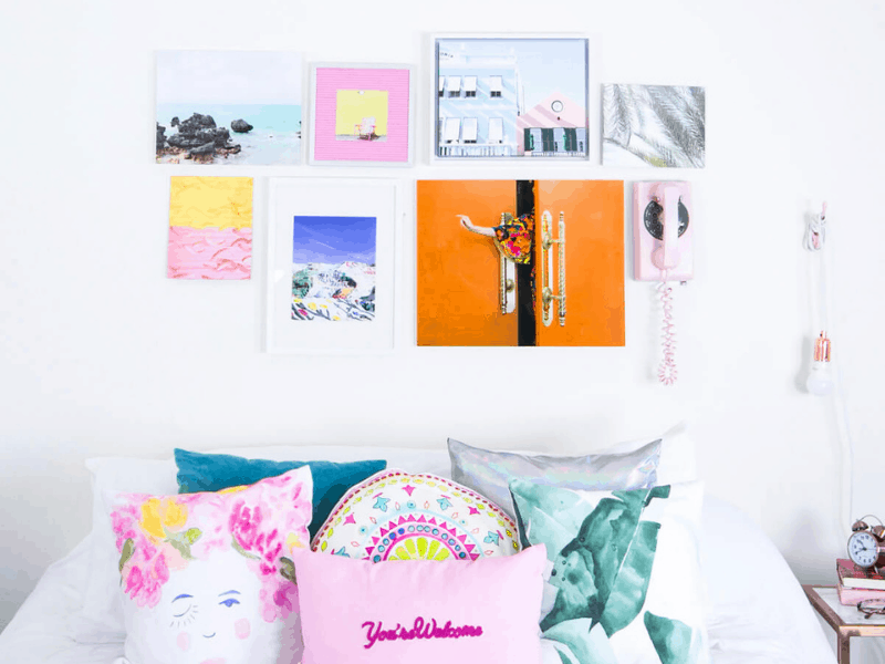 Bright color image of bedroom with colorful cushions on the bed and posters on the wall socialsquares_LISHcollab39-2.jpeg