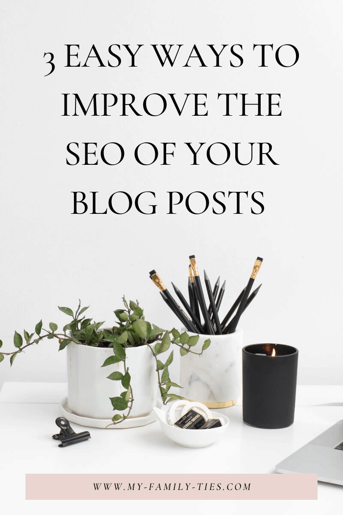 plant pot, marble pencil holders with black pencils, black candle on white table top, open laptop, social squares, improve SEO on your blog post, 