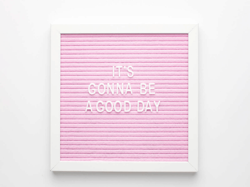 It's gonna be a good day quote on white framed picture with pink lined background, work from home, social squares,